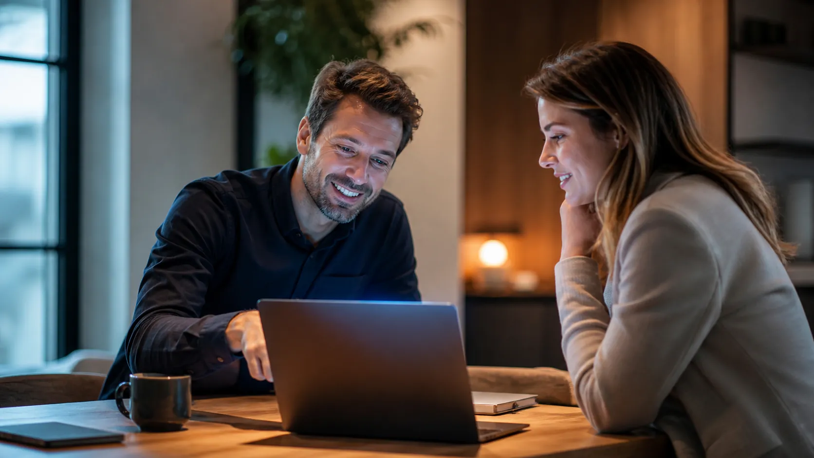A Bosstek consultant walking a small-business owner through their AI setup on a laptop